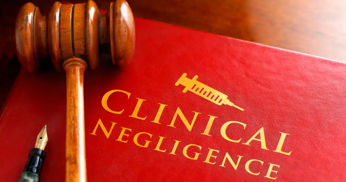 Medical malpractice legal book with gavel representing pre-settlement funding for clinical negligence cases