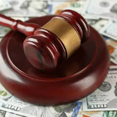 gavel and money representing pre-settlement funding